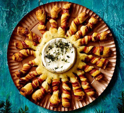 Baked camembert with bacon-wrapped breadsticks