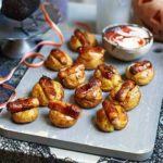 Halloween mini baked potatoes with sticky sausages